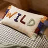 Almohadón Zelda algodón blanco de letras bordadas multicolor 30 x 50 cm en Multicolor - Textiles, Uruguay | Kavehome, vista 2 de 6