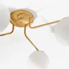 Lámpara de techo Brisia de metal con acabado latón cepillado y 4 bolas de cristal glaseado Ø15 cm en Dorado - Lámparas colgantes, Uruguay | Kavehome, vista 4 de 6