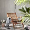 Butaca Grignoon de madera maciza de acacia y ratán sintético trenzado en Beige, Natural - Butacas, banquetas y puffs, Uruguay | Kavehome, vista 2 de 8