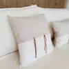Almohadón lazo cuadrado a rayas blanco y beige (60cm) en Gris - Textiles, Uruguay | Dreams On Time, vista 1 de 3