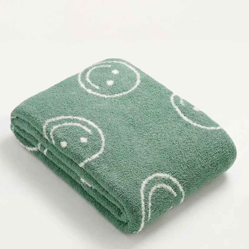 Manta Suave Caritas en Verde - Textiles, Uruguay | Cabana