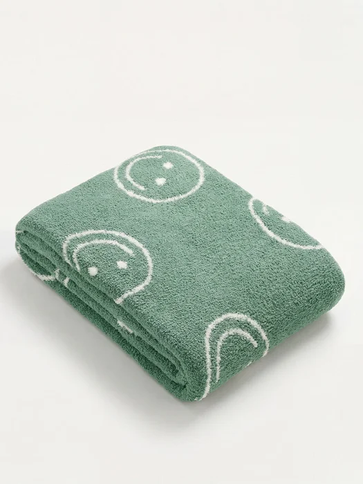 Manta Suave Caritas en Verde - Textiles, Uruguay | Cabana, vista 2
