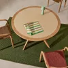 Mesa redonda Julieta de polycemento beige y madera maciza de acacia Ø 120 cm FSC 100% en Madera natural - Muebles para el exterior, Uruguay | Kavehome, vista 2 de 7