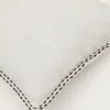 Almohadón Sinet de lino blanco con bordado negro - 30 x 50 cm en Blanco - Textiles, Uruguay | Kavehome, vista 4 de 4