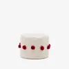 Puf Manua de algodón beige con borlas - rojo Ø 40 cm en Multicolor - Butacas, banquetas y puffs, Uruguay | Kavehome, vista 1 de 3