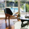 Butaca Shell - Natural y cuero negro en Negro - Butacas, banquetas y puffs, Uruguay | Walnut, vista 1 de 5