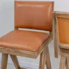 Banqueta en madera teca y cuero en Beige - Butacas, banquetas y puffs, Uruguay | Entrecasa, vista 4 de 5